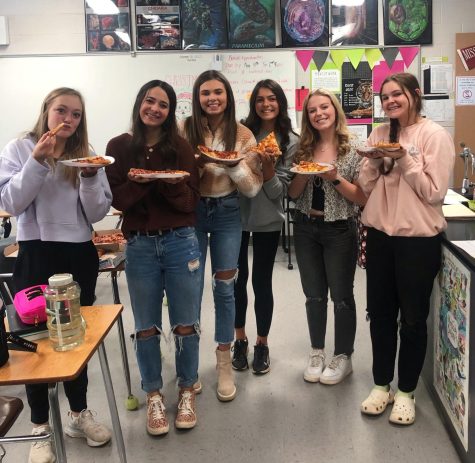 The yearbook staff gets some well earned pizzas 